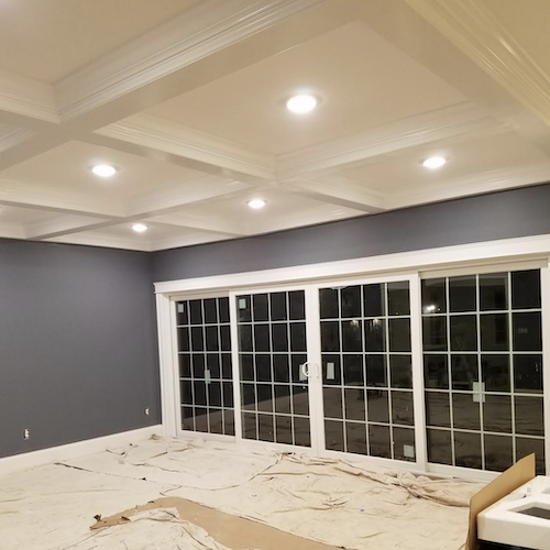 New home. White ceiling. Blue walls and white trim sliding doors.