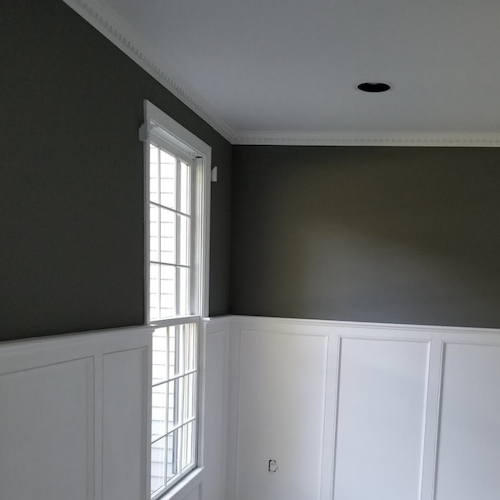 Dark green dining room with white Wayne's coating