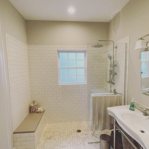 Restored bathroom with beige walls. New tile.