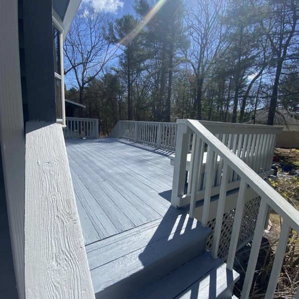 Blue deck and white railing.