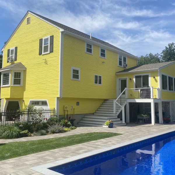 Millis Massachusetts colonial painted yellow exterior